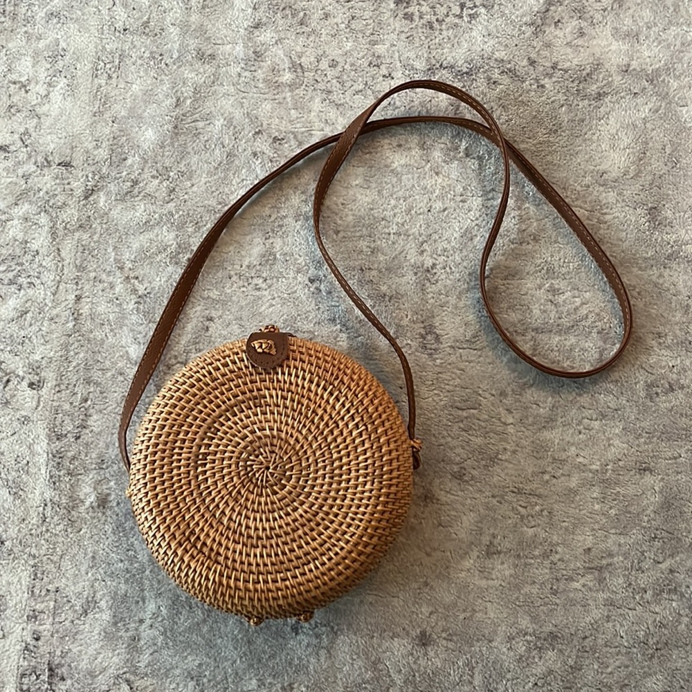 Wicker canteen shaped purse with brown straps
